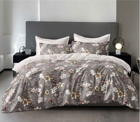 A king size fitted bedsheets set with pillow covers featuring a floral pattern, displayed in a room with a view of mountains.
